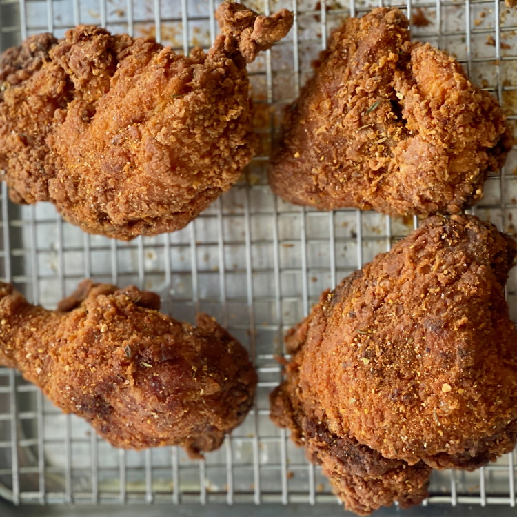 Image of While the chicken is still warm, sprinkle one tablespoon of LBFC blend onto all of the pieces for a final seasoning.